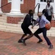 Virginia State President Makola Abdullah, formal wear and all, nonetheless lights up this poor student.